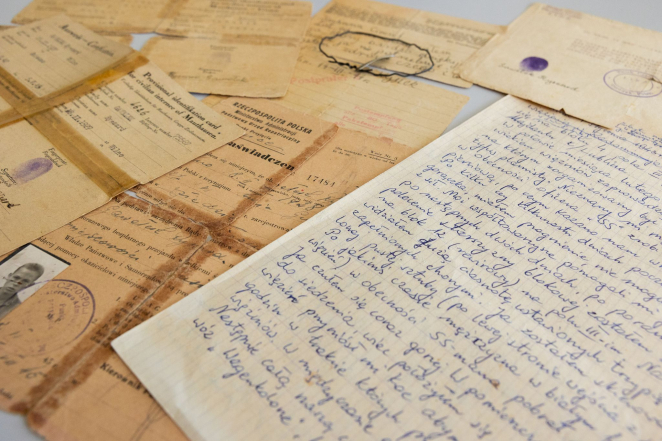 A collection of yellowed documents, some taped together